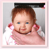 Ashton-Drake Galleries baby doll hair styling tip: gently comb the doll's hair in one direction, starting at the crown