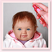 Ashton-Drake Galleries baby doll hair styling tip: lightly mist the doll's hair and comb it again